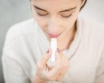 woman-applying-lip-balm.jpg